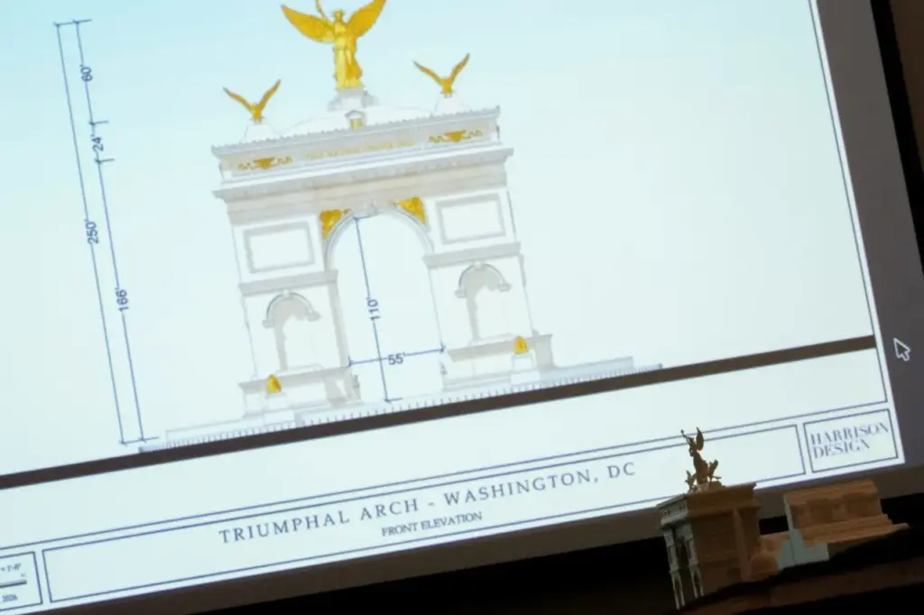 An image and model of President Donald Trump's proposed triumphal arch to commemorate the country's 250th anniversary are displayed during a public meeting of the Commission of Fine Arts at the National Building Museum on April 16, 2026 in Washington, DC. The Commission of Fine Arts voted unanimously to move forward with a proposed 250-foot arch informally dubbed the 