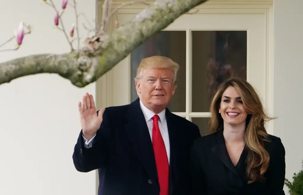 US-POLITICS-TRUMP US President Donald Trump poses with former communications director Hope Hicks shortly before making his way to board Marine One on the South Lawn and departing from the White House on March 29, 2018. (Photo by MANDEL NGAN/AFP via Getty Images)
