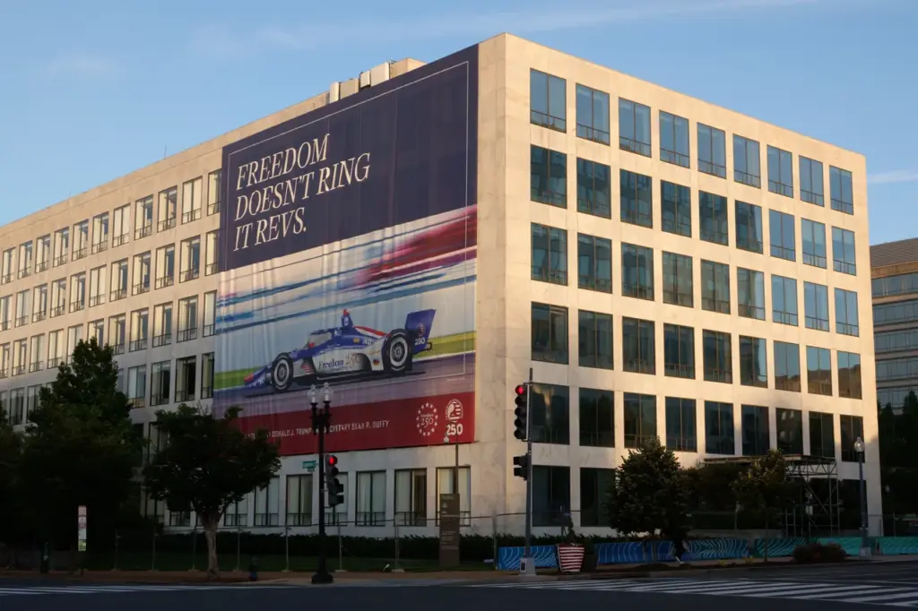 A banner for the Freedom 250 Grand Prix car race hangs on the Wilbur Wright Federal Building on June 2, 2026 in Washington, DC. (Photo by Kevin Carter/Getty Images)