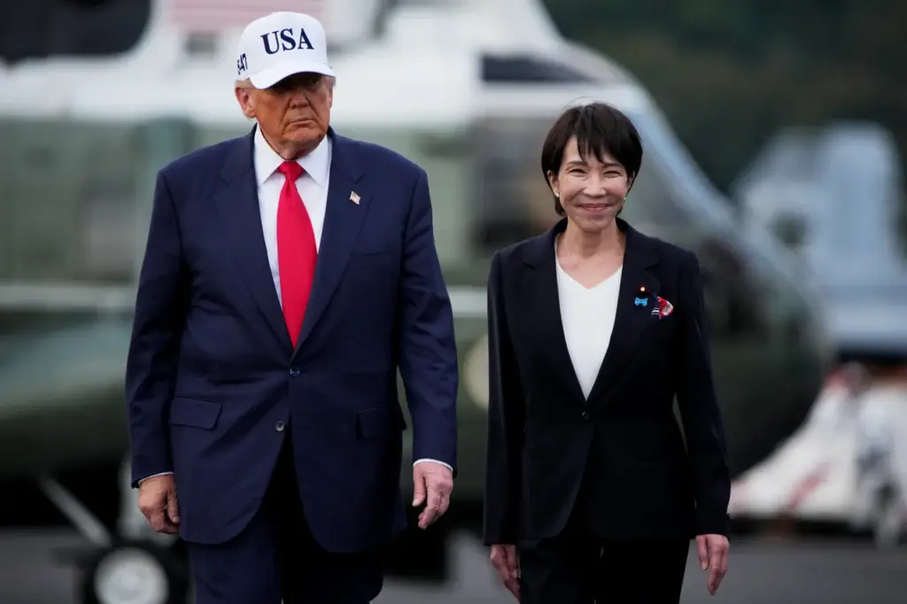 U.S. President Donald Trump and Japanese Prime Minister Sanae Takaichi arrive to speak to troops aboard USS George Washington at Fleet Activities Yokosuka on October 28, 2025 in Yokosuka, Japan. (Photo by Andrew Harnik/Getty Images)