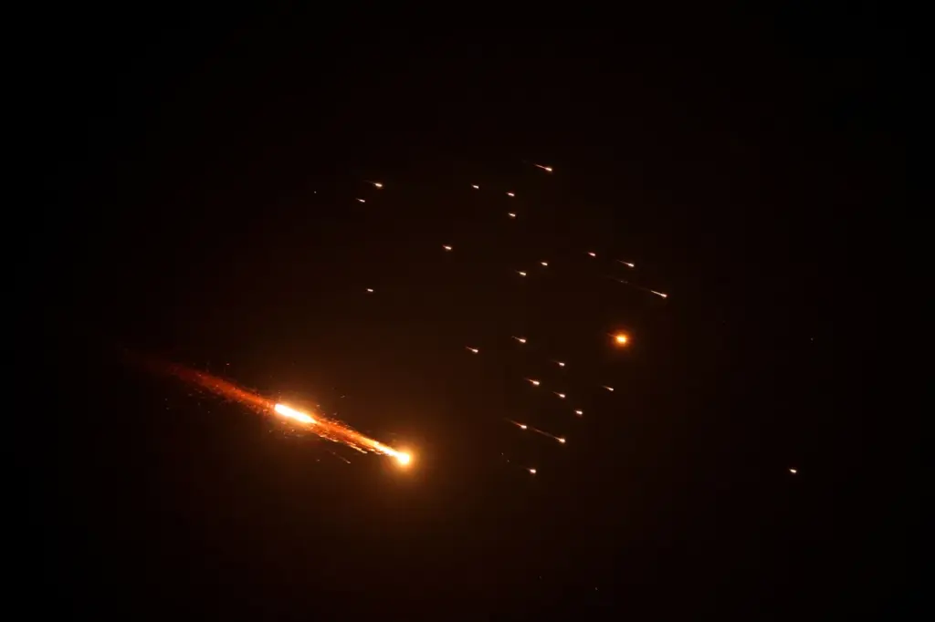 Rocket trails are seen in the sky above the Israeli coastal city of Netanya, amid a fresh barrage of Iranian missile attacks on March 27, 2026. On March 27 evening, the Israeli army reported missiles fired by Iran at Israel, as sirens sounded in Jerusalem and explosion noises were heard in Jericho, in the occupied West Bank, according to AFP journalists. (Photo by JACK GUEZ / AFP)