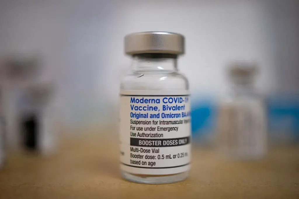 FILE PHOTO: A vial of the Moderna coronavirus disease (COVID-19) booster vaccine targeting BA.4 and BA.5 Omicron sub variants is pictured at Skippack Pharmacy in Schwenksville, Pennsylvania, U.S., September 8, 2022. REUTERS/Hannah Beier/File Photo